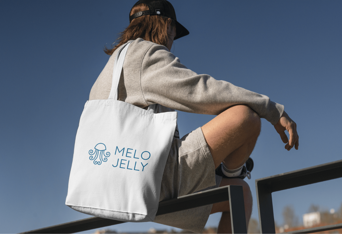 A fabric tote bag with MeloJelly's logo.